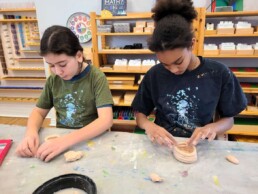 Lyonsgate Montessori School Elementary students making clay coil pots as part of their ancient Greek studies.