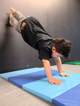 Lyonsgate Montessori School Elementary student learning acro during winter phys. ed. dance class at Elev8 Dance.