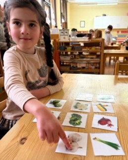 Lyonsgate Montessori School Casa student building her French language food vocabulary.