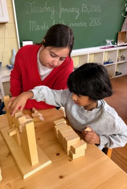 Lyonsgate Montessori School Casa student receiving a presentation of the Montessori Roman Arch material.