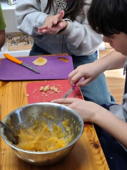Lyonsgate Montessori School Elementary students making pineapple tarts for Lunar New Year.