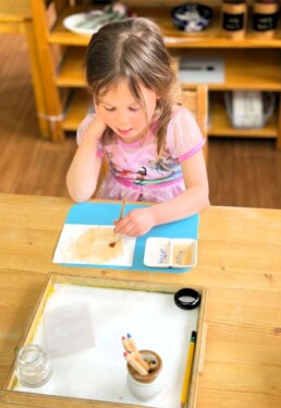 Lyonsgate Montessori School Casa student working with watercolour pencils to explore colour and creativity.