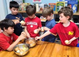 Lyonsgate Montessori School Elementary students peeling onions to make botanical dye.