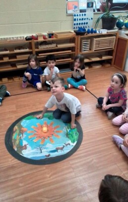 Lyonsgate Montessori School Casa student participating in his birthday celebration with his class.