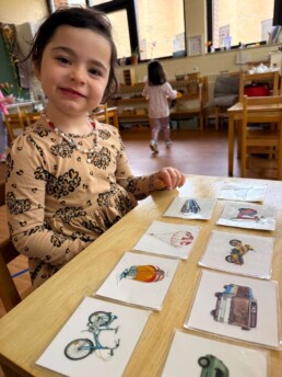 Lyonsgate Montessori School Casa student building her French vocabulary of forms of transportation.