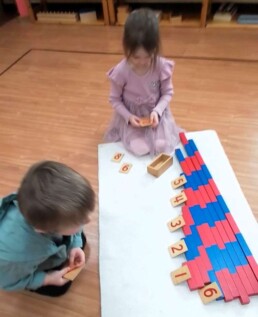 Lyonsgate Montessori School Casa students working towards mastering the Montessori Number Rods material.