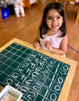 Lyonsgate Montessori School Casa student entering the world of numeracy by learning to write number symbols from 1 to 10.