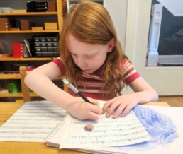 Lyonsgate Montessori School Elementary student undertaking her first research project, about Neptune.