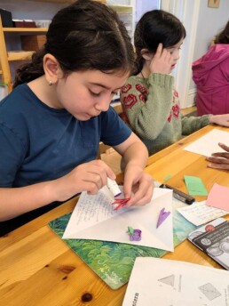 Lyonsgate Montessori School Elementary student working on a poetry triorama.