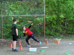 Lyonsgate Montessori School Elementary student taking a shot put attempt at a recent track and field event with other area Montessori schools.