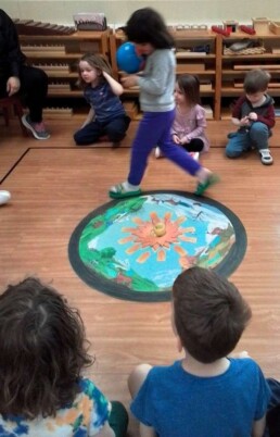 Lyonsgate Montessori School Casa student taking trips around the sun to celebrate her birthday.