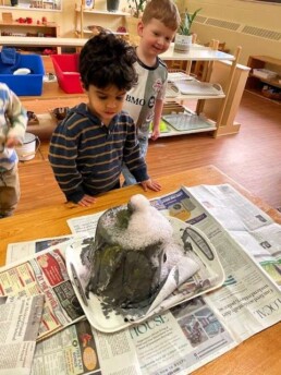 Lyonsgate Montessori School Toddler students built and erupted their own volcano.