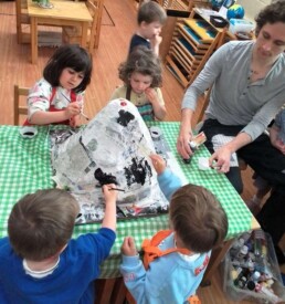 Lyonsgate Montessori School Casa students painting their volcano.