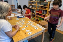Lyonsgate Montessori School Elementary student engaged in French language number learning.