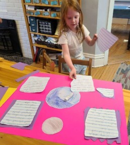 Lyonsgate Montessori School Elementary student preparing her planet project for presentation.