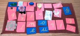 Lyonsgate Montessori School Casa student work connecting objects to their initial sounds with the Montessori Sandpaper Letters material.